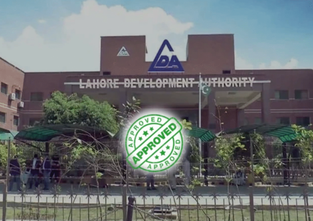 Front view of the Lahore Development Authority (LDA) building in Lahore, Pakistan, with a green “Approved” stamp overlay symbolizing official project approval.